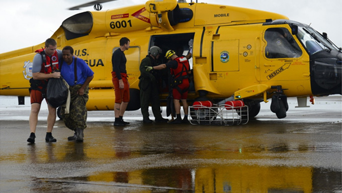 A Coast Guard rescue team helps Hurricane Harvey survivors