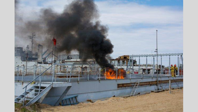 Testing a copper blanket to burn spilled oil more efficiently from the water