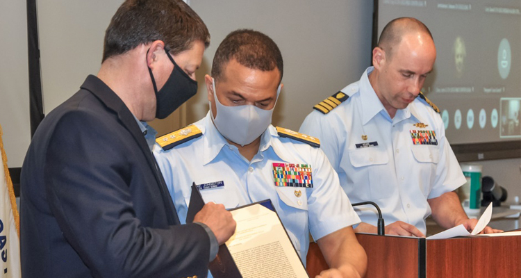 Technical Director Al Arsenault accepts the Meritorious Unit Commendation