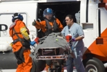 patient being loaded into a Coast Guard Helicopter