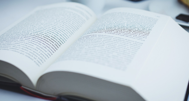 Image of an open book filled with non-English text.