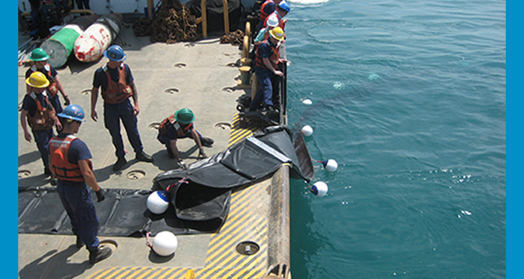 personnel deploy an underwater barrier